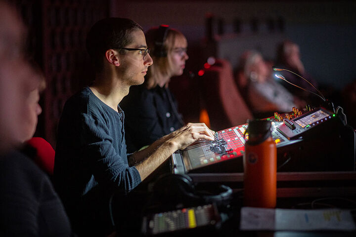 A film technician works in the IU Cinema.